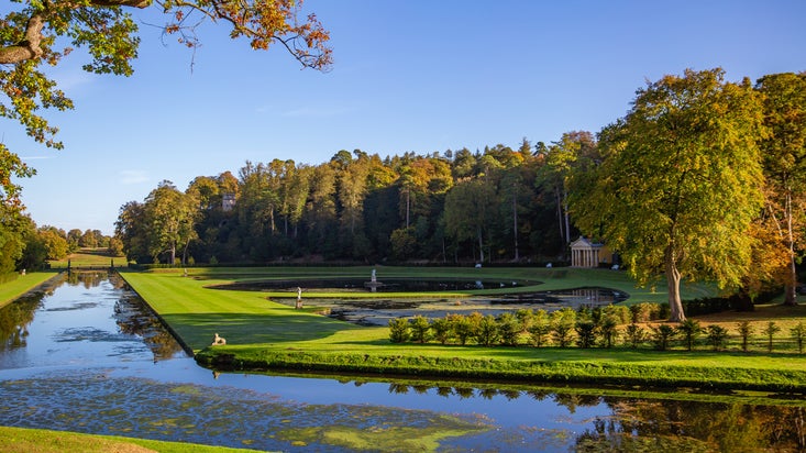 Autumnal view across Studley Royal Water Garden
